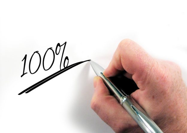 Brian Britt "Your 401K" blog post image of a hand writing 100 percent